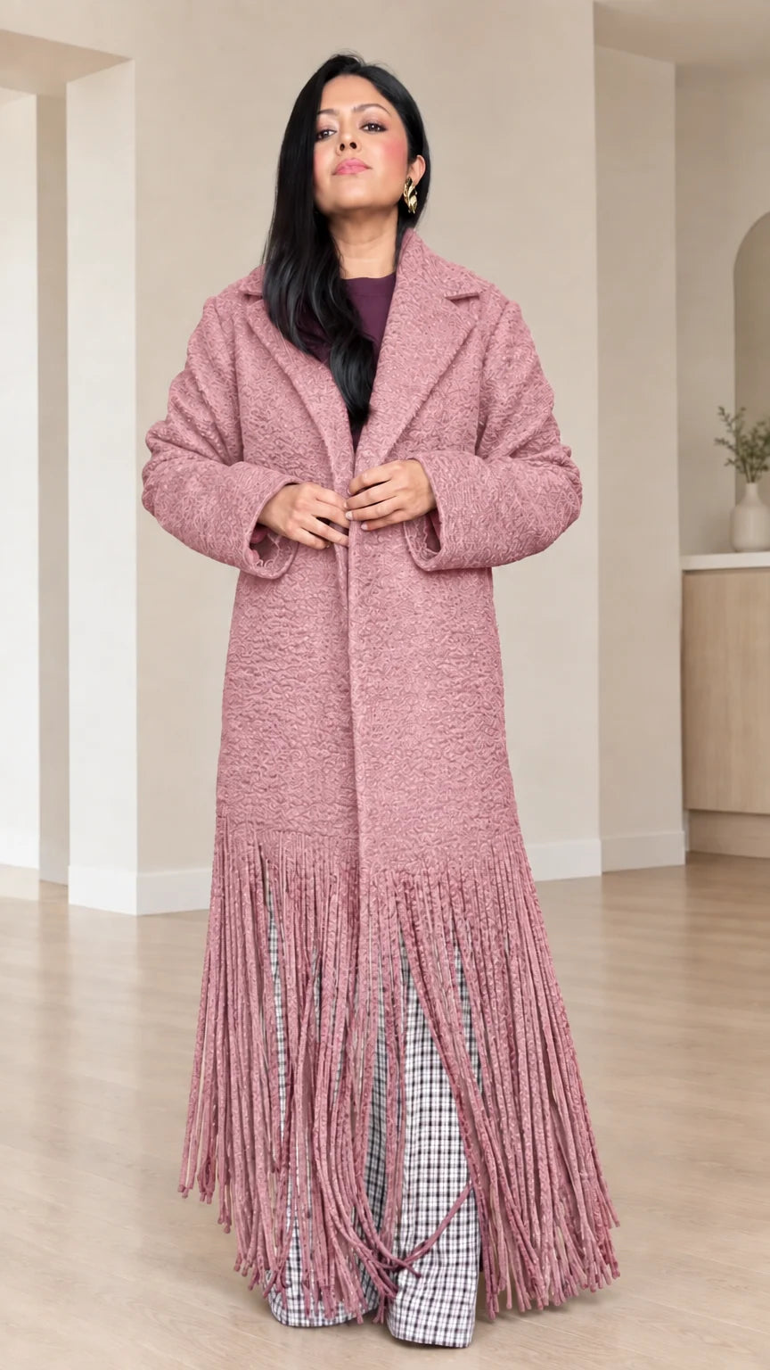 Front view of model wearing Dusty Rose bouclé fringe maxi coat
