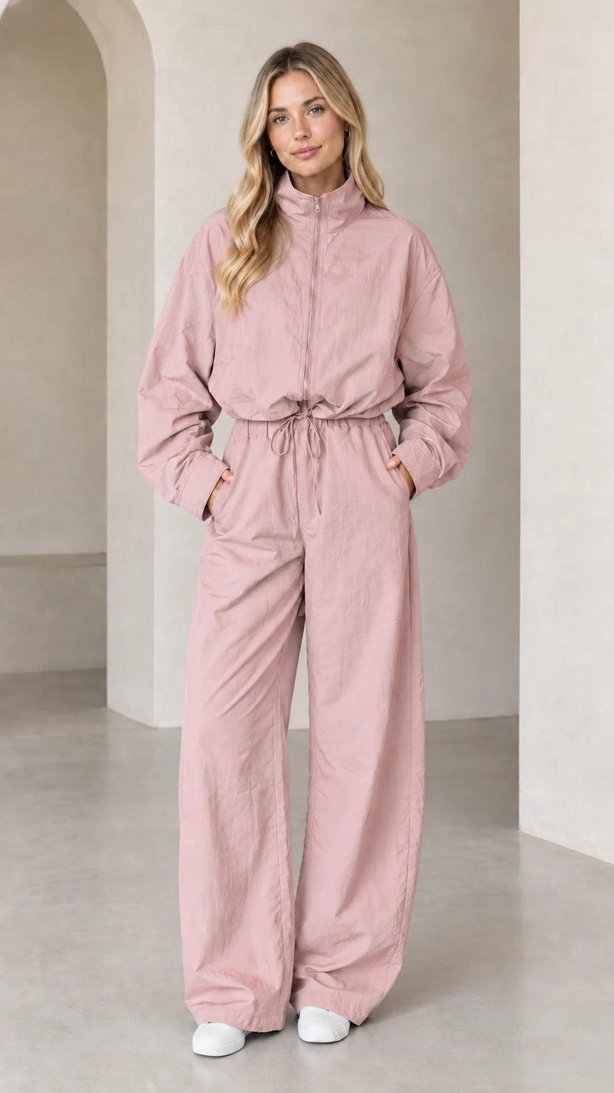 Front full-length view of woman wearing Dusty Pink zip-up wide-leg utility jumpsuit