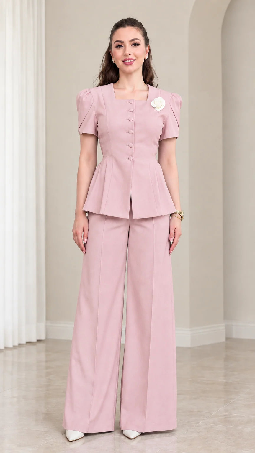 Model wearing Dusty Pink short sleeve peplum jacket and wide leg pants