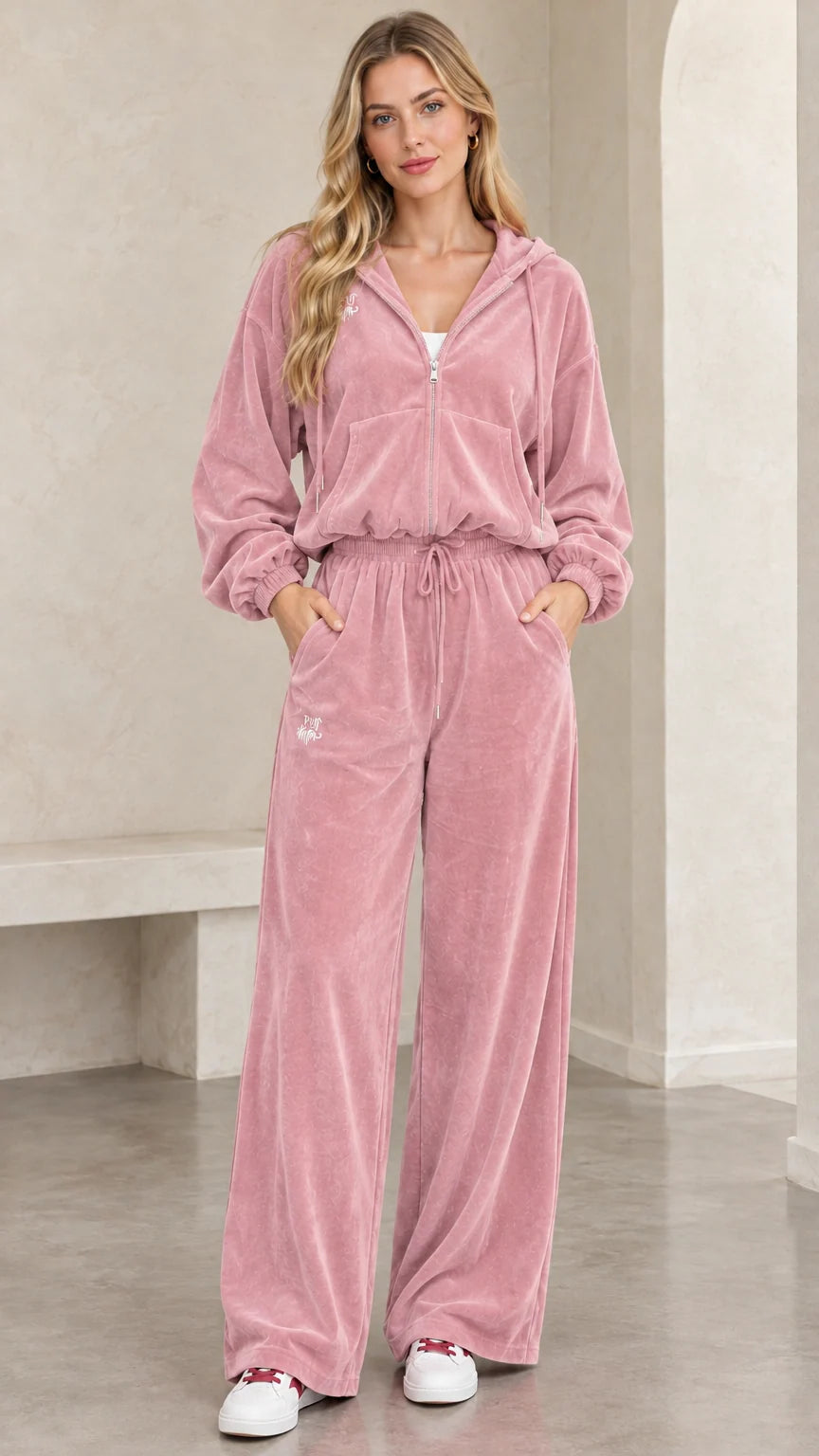 Front view of woman wearing dusty pink plush velour tracksuit set