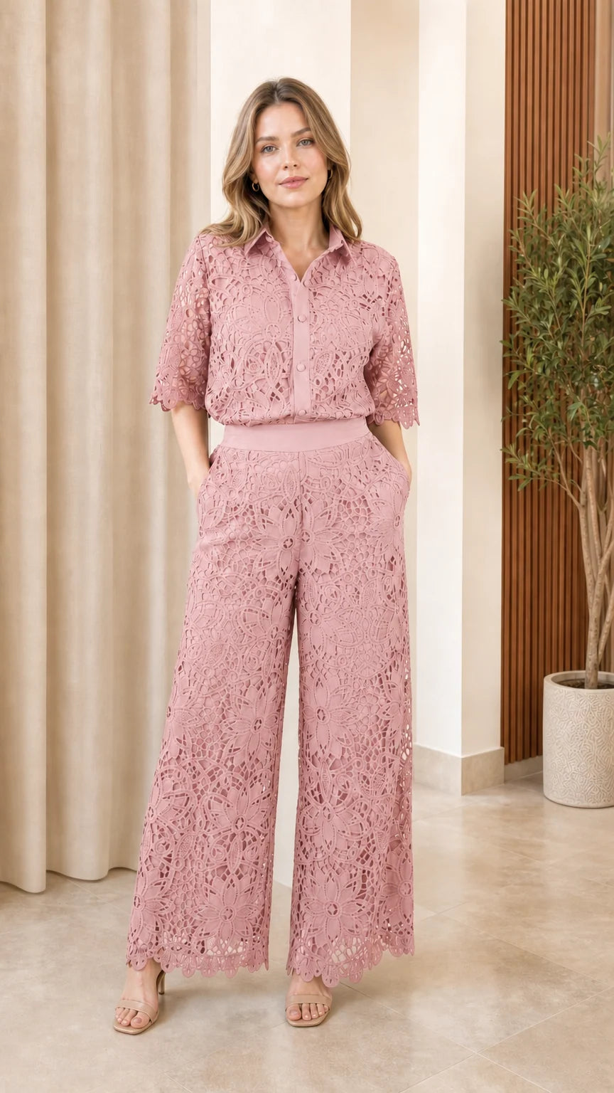 Front view of model wearing pink lace matching set