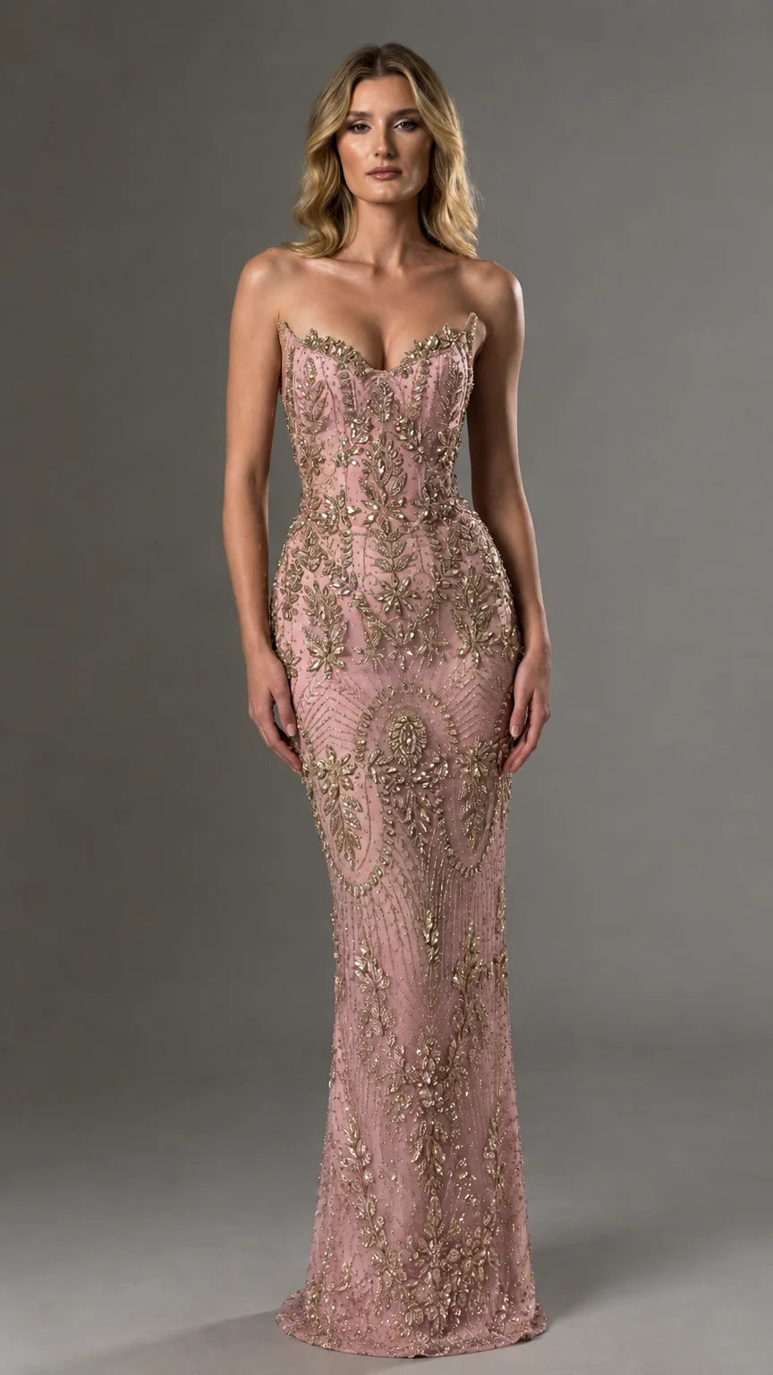 Front view of model wearing blush pink and gold strapless beaded evening dress