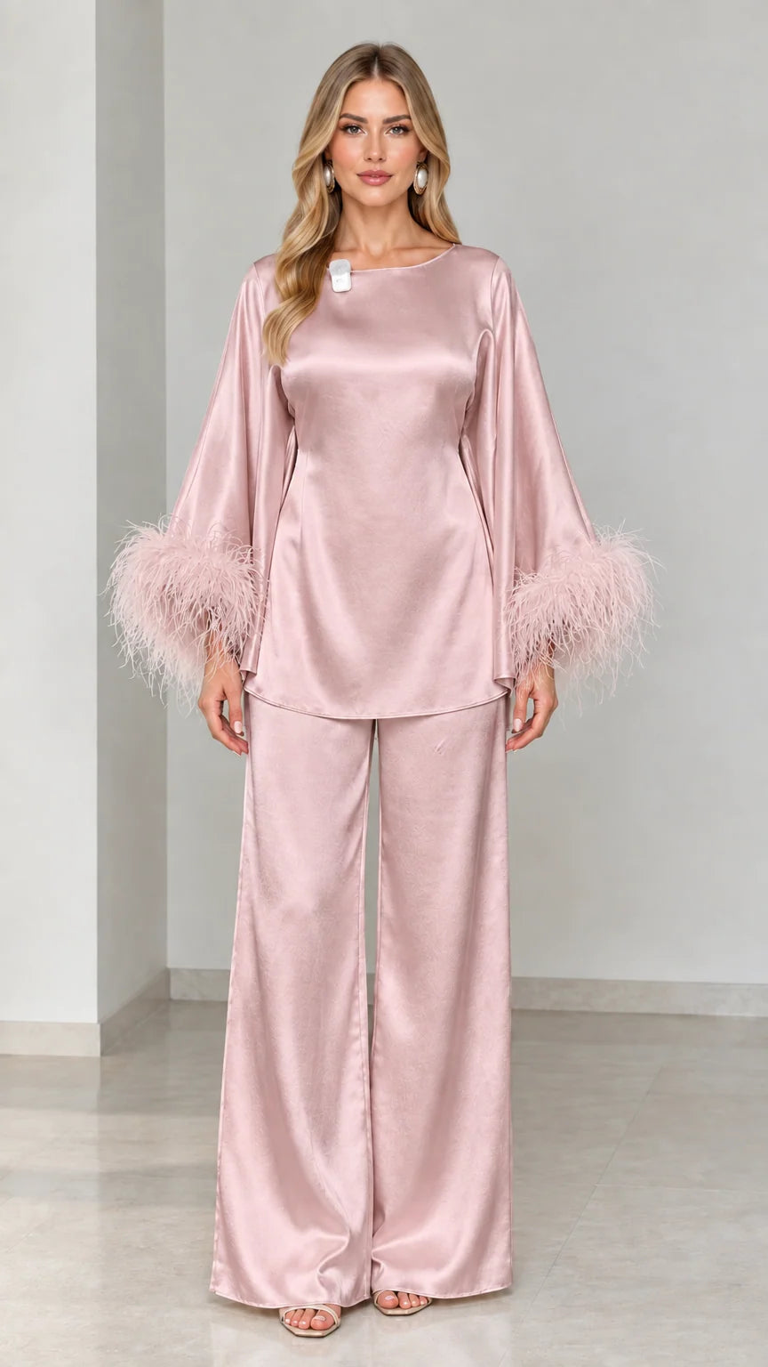 Blush pink satin two-piece tunic and wide-leg pants set with feather trim