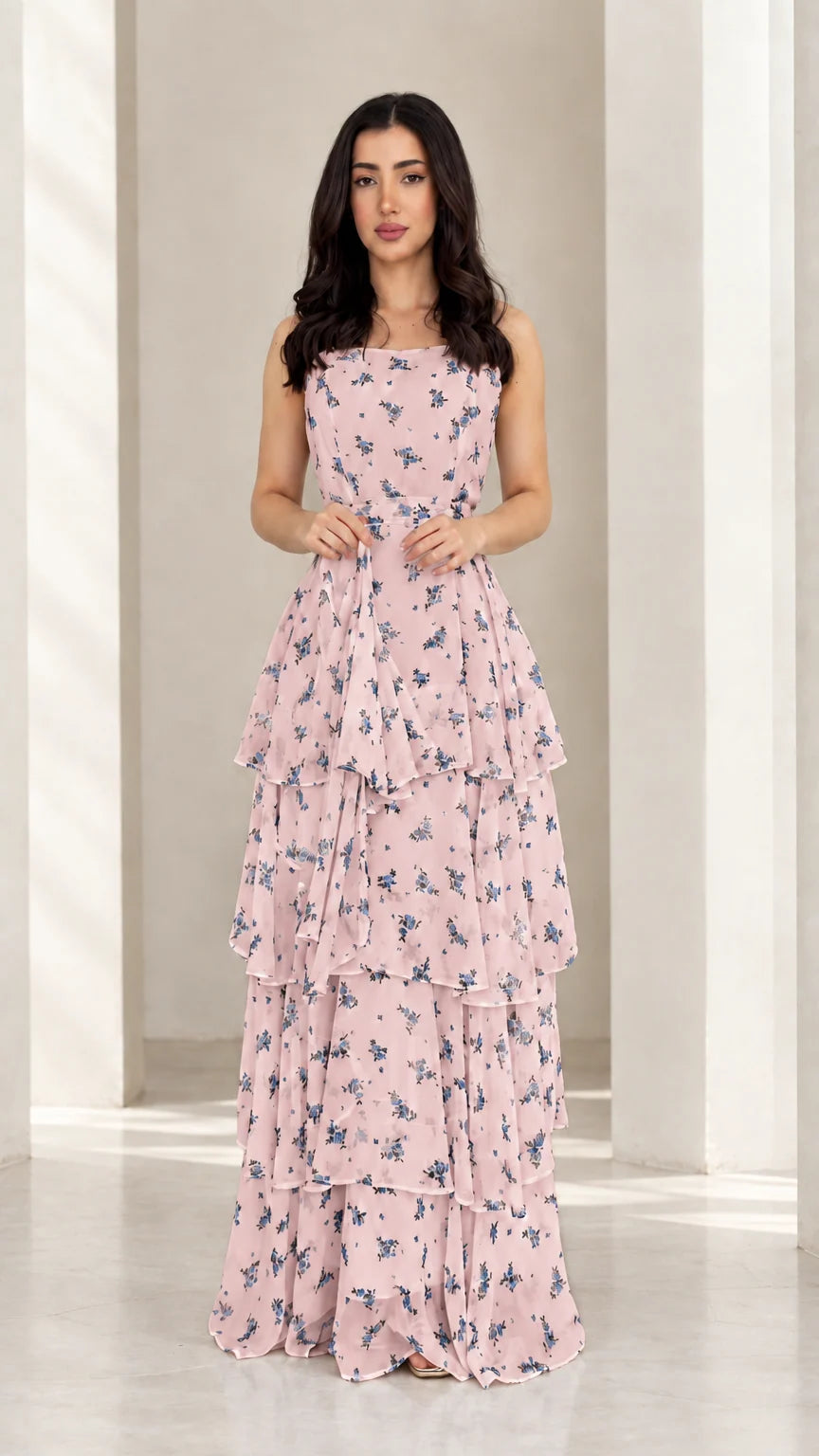 Model wearing soft pink floral tiered ruffle maxi dress