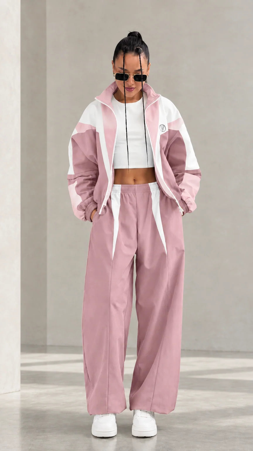 Model wearing Dusty Pink colorblock tracksuit set with white accents