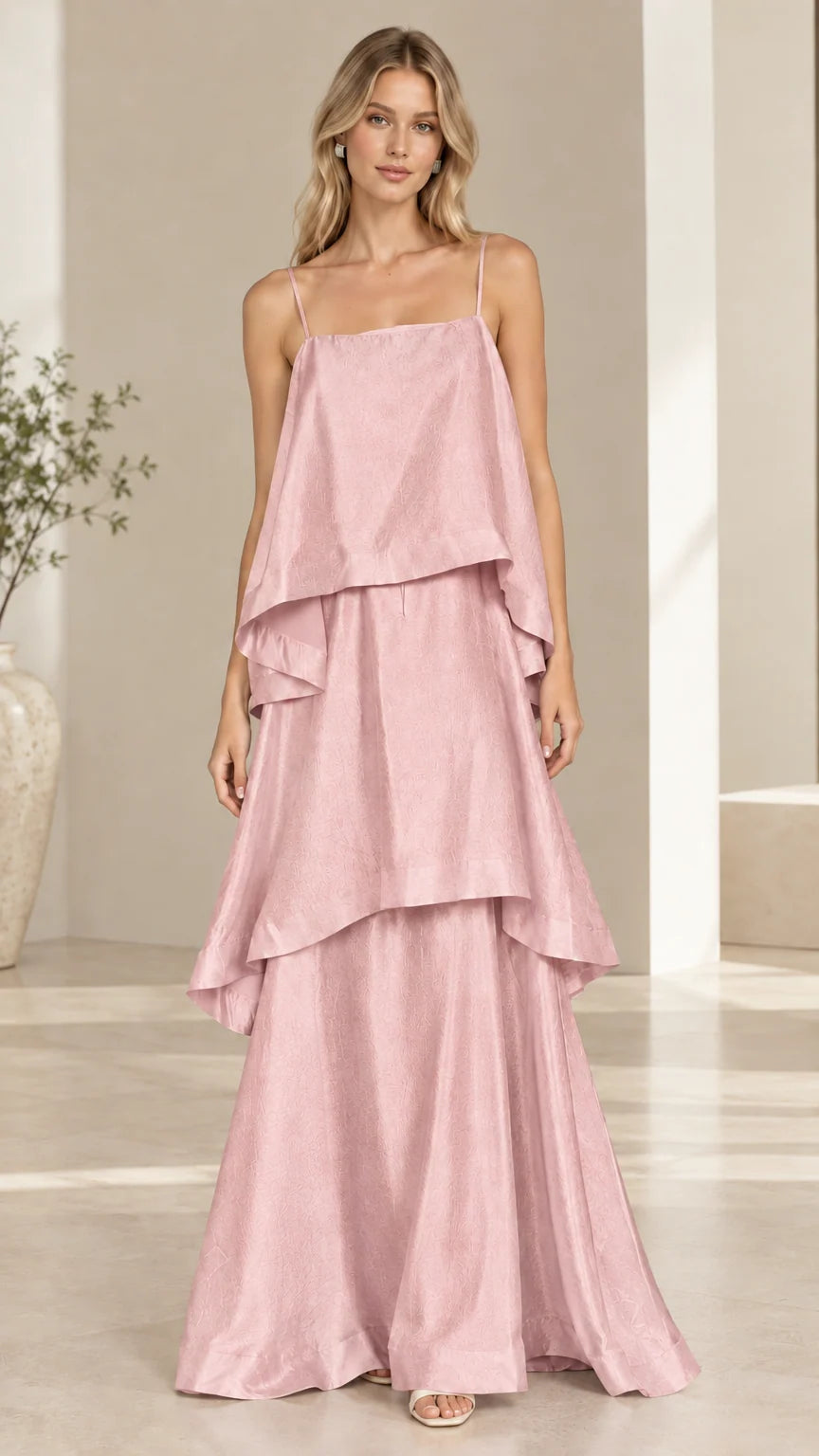 Model wearing blush pink tiered cami maxi dress front view