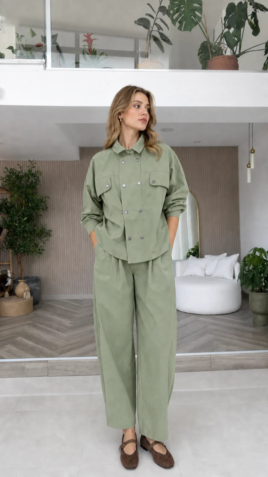 Model wearing sage green double-breasted long sleeve matching pant set