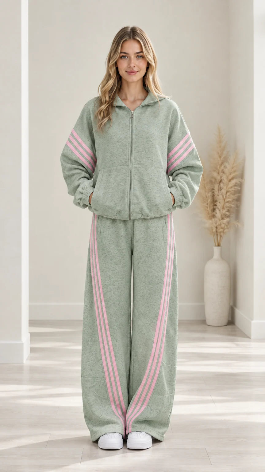 Woman modeling Sage Green two-piece casual tracksuit set with pink side stripes