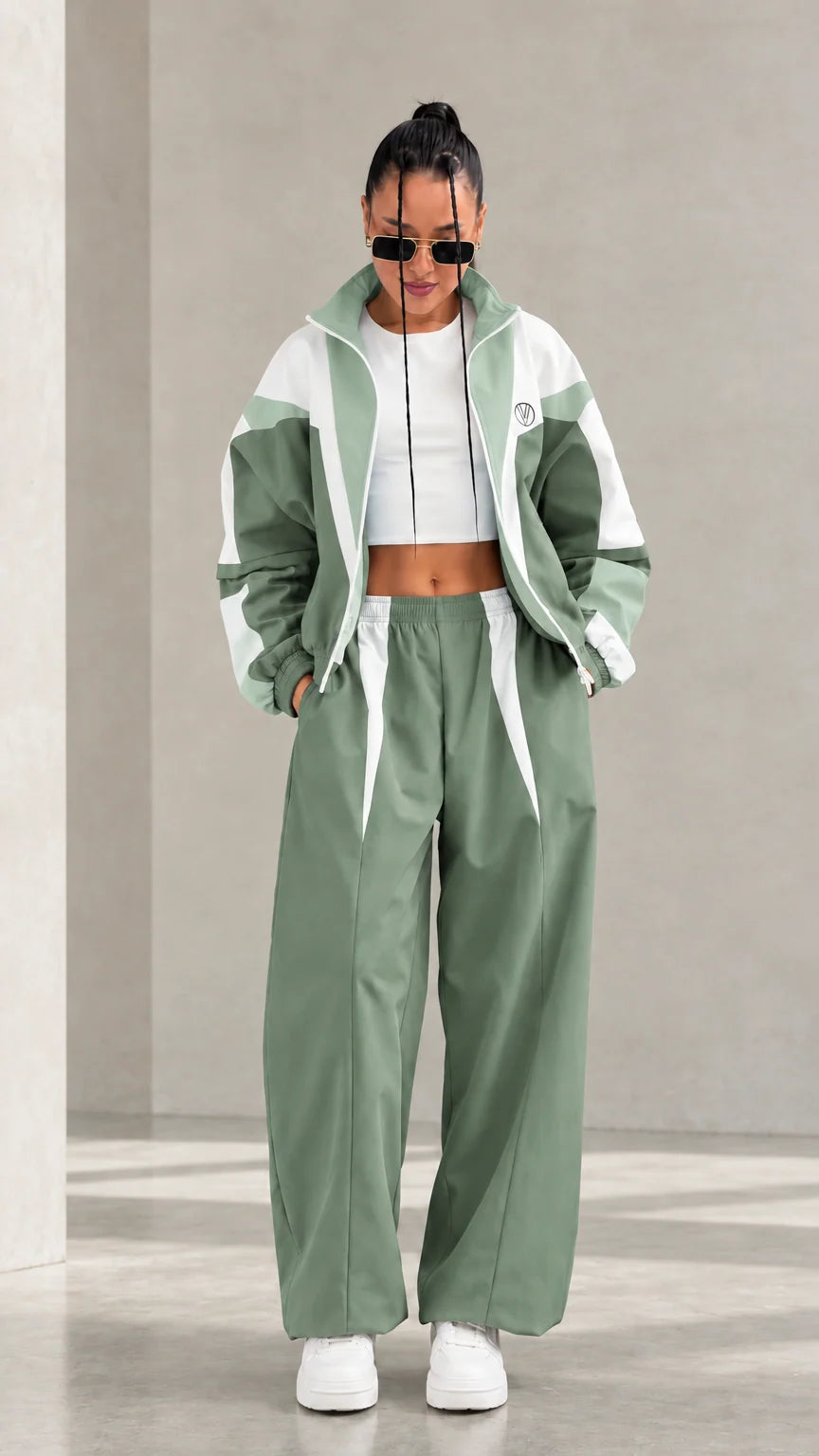 Model wearing Sage Green colorblock tracksuit set with white accents
