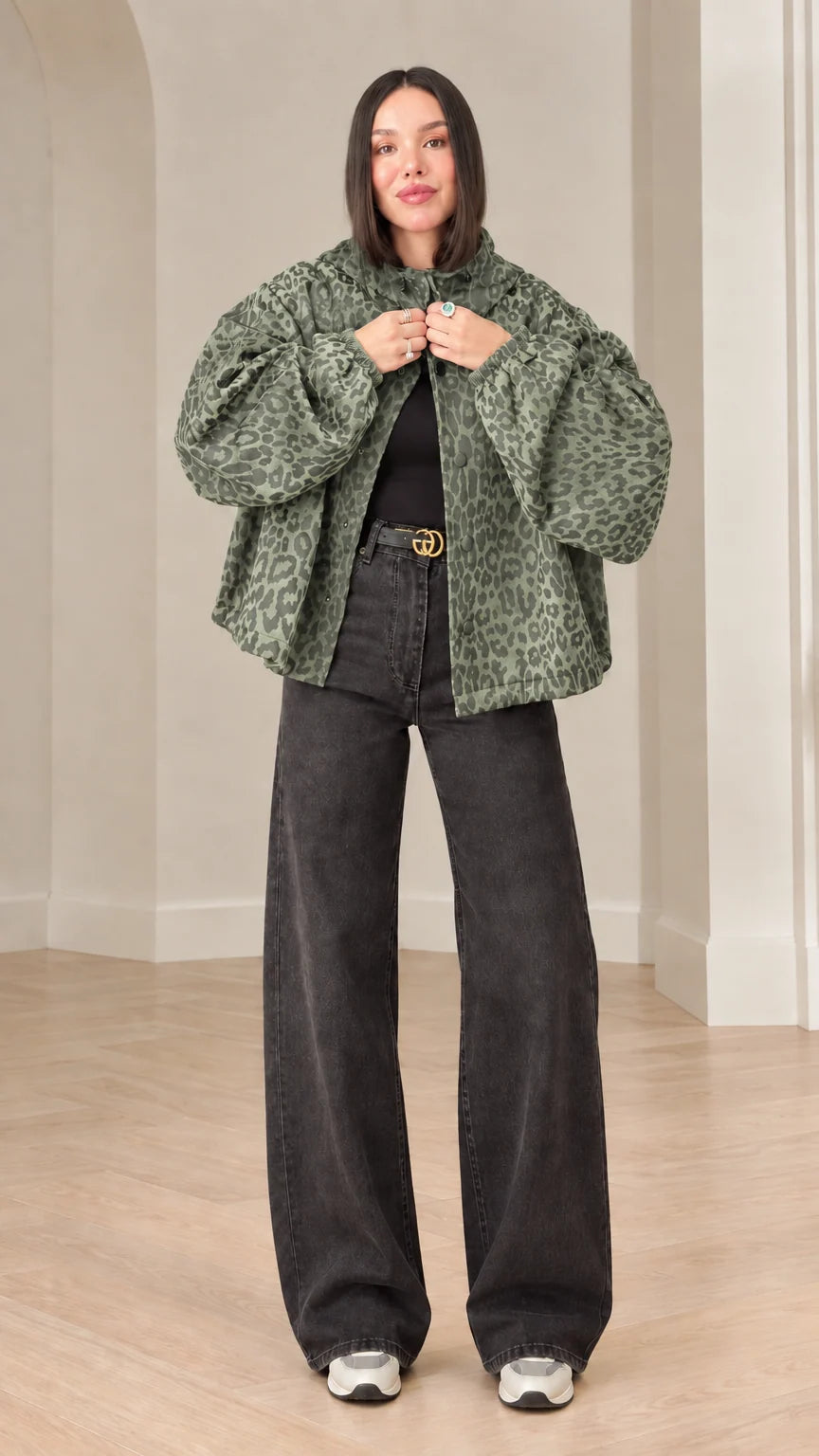 Model wearing sage green leopard print hooded jacket with wide leg denim pants