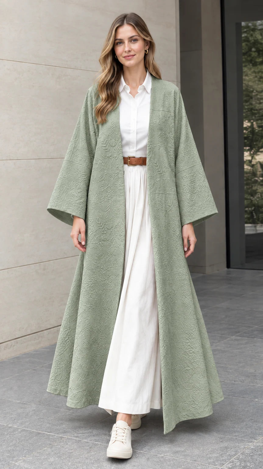 Front full-length view of woman wearing sage green embossed jacquard open-front duster