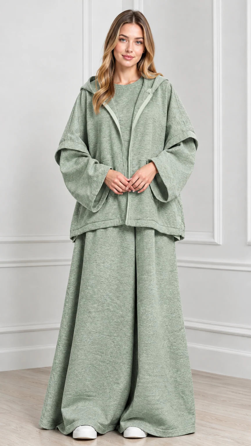 Front view of woman wearing Sage Green hooded cape jacket and wide-leg pants set