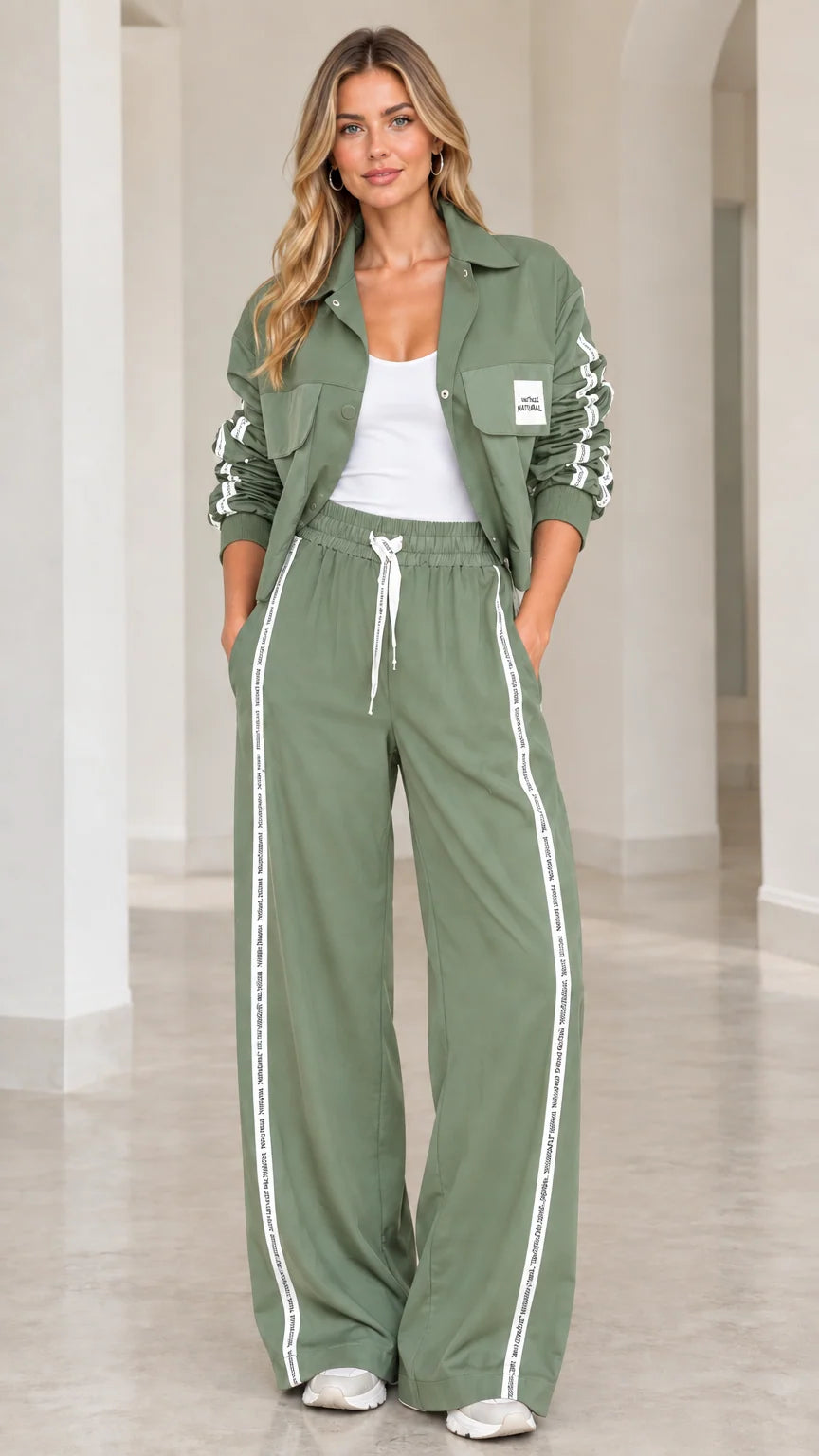 Model wearing Sage Green 2-piece cropped jacket and wide-leg track set