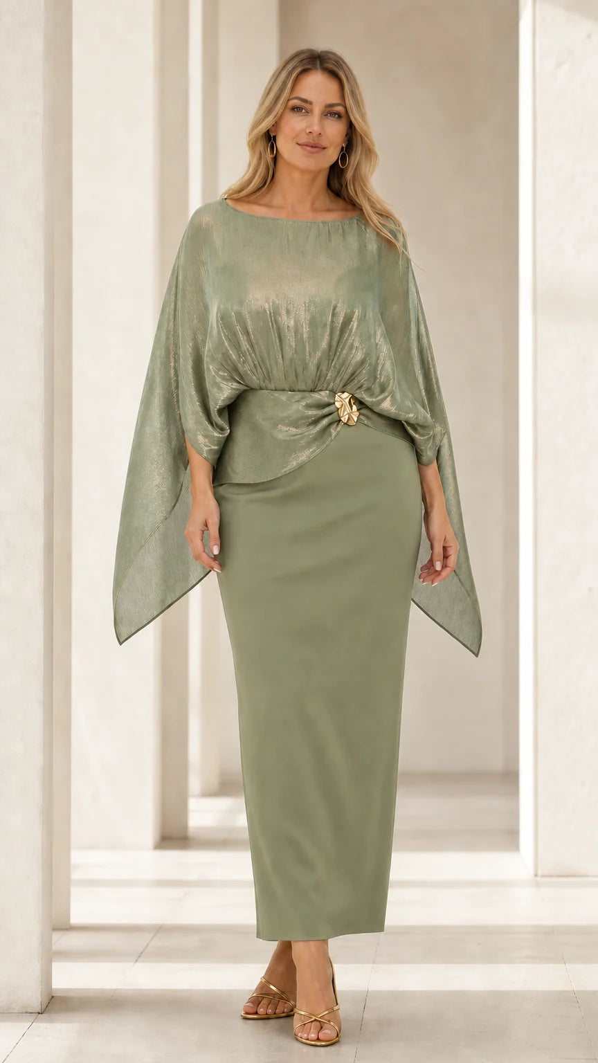 Front view of woman wearing sage green metallic cape overlay maxi dress