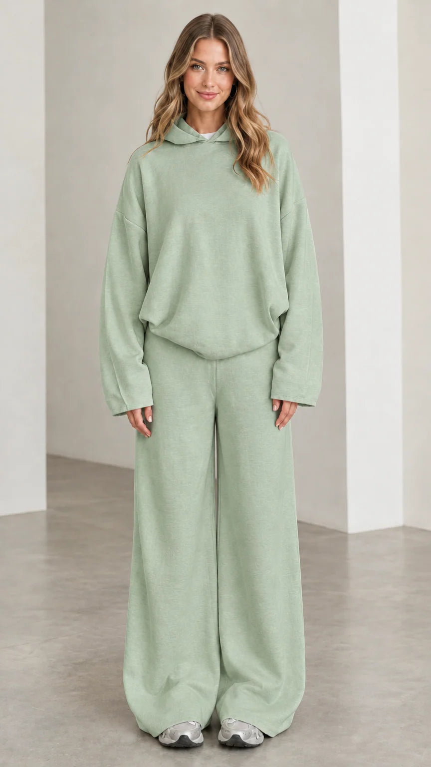 Front view of woman wearing Sage Green relaxed hoodie and wide leg pants set