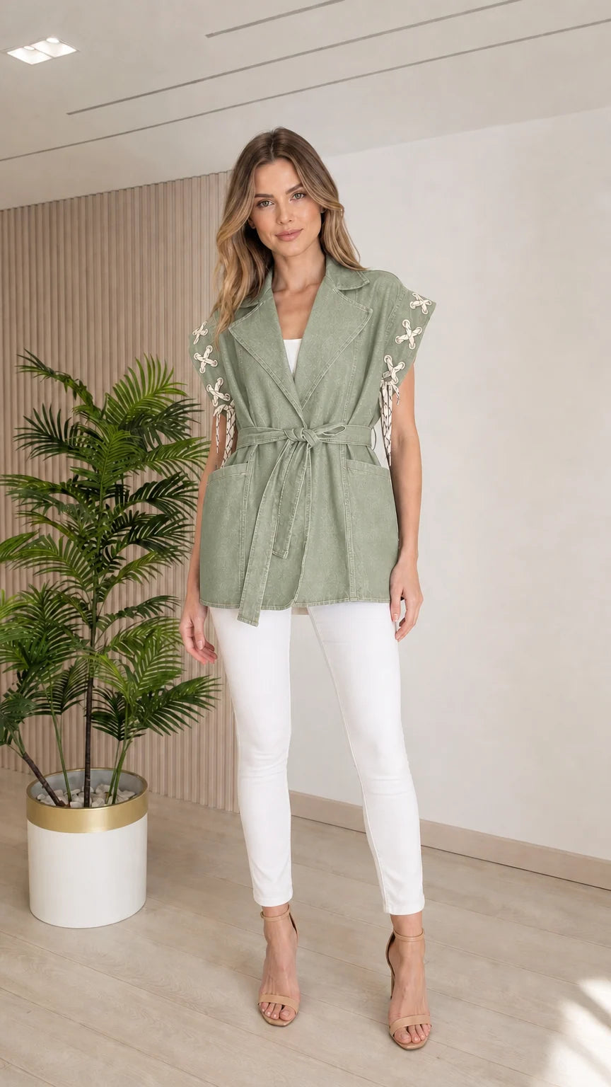 Model wearing the Sage Green sleeveless denim vest with shoulder cord accents