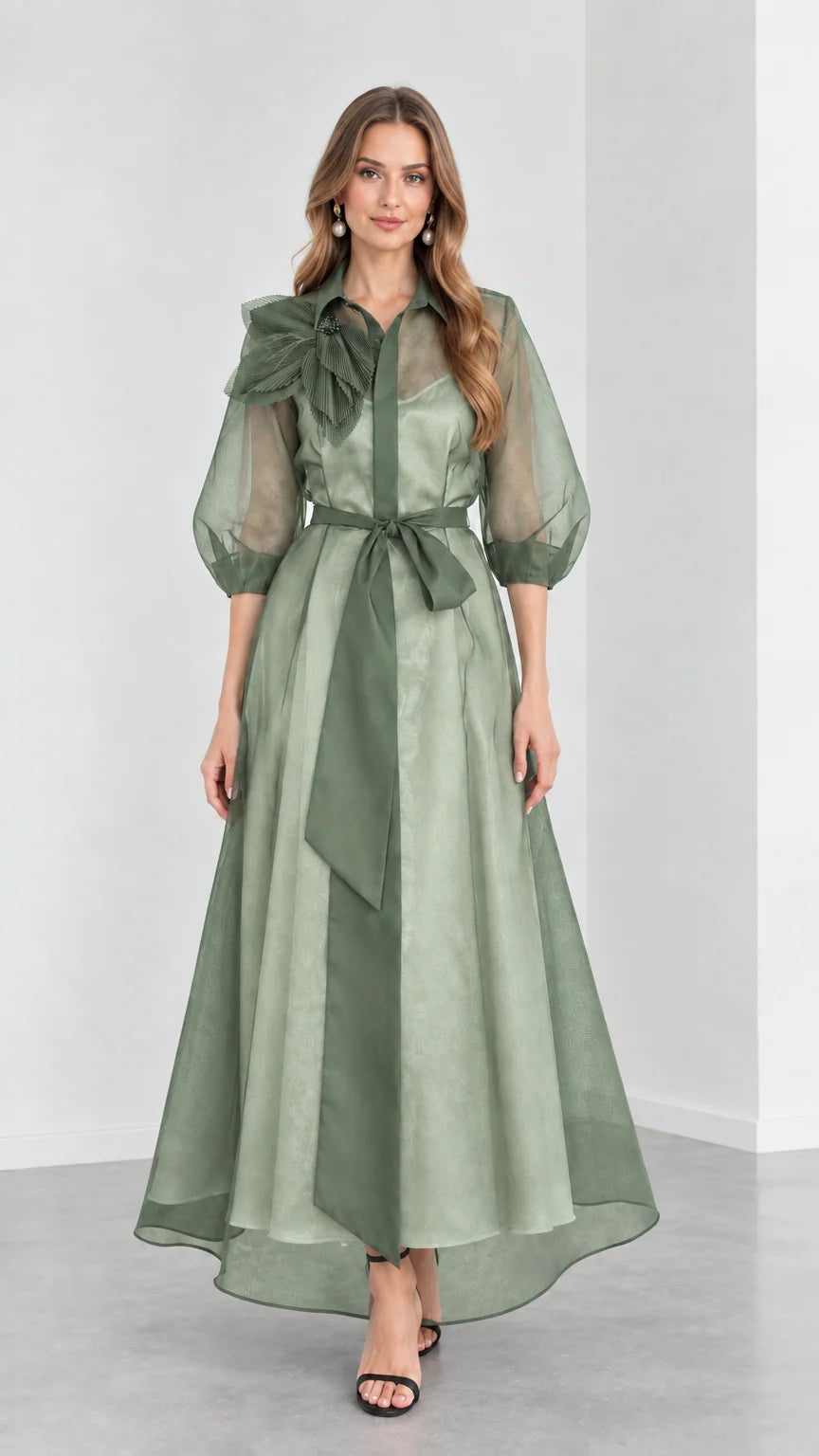 Front view of model wearing monochromatic Sage Green organza collared maxi gown with tie sash