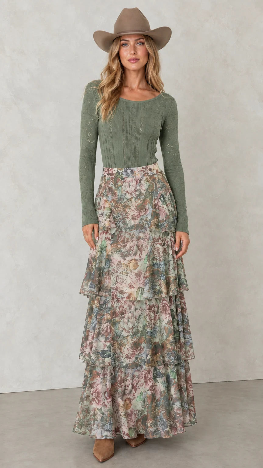 Model wearing Sage Green tiered floral maxi skirt with olive green top