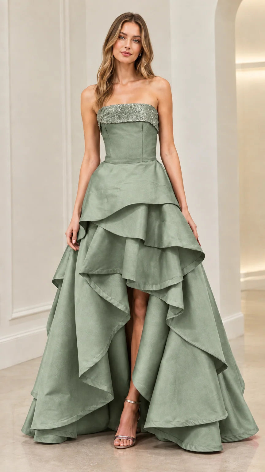 Front view of model wearing Sage Green strapless sequin-trim tiered high-low ball gown