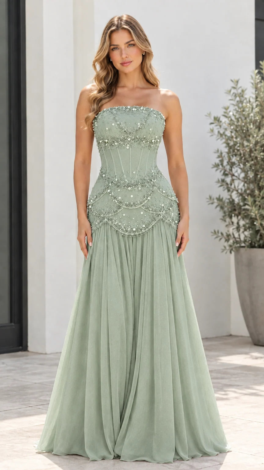 Model wearing Sage Green strapless beaded corset drop-waist evening gown