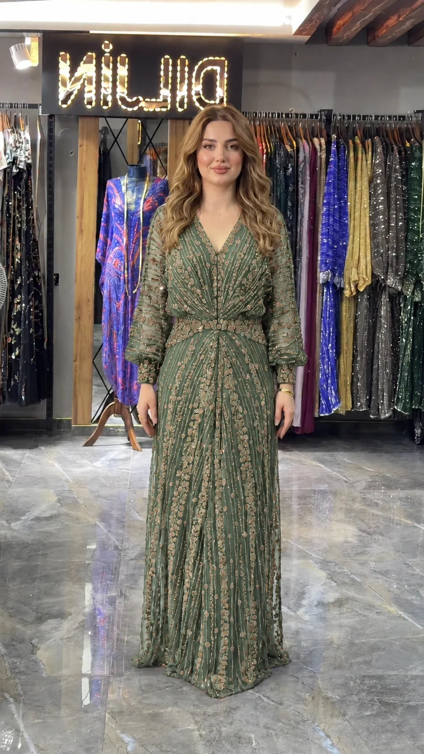 Sage green embellished V-neck formal evening maxi gown on model