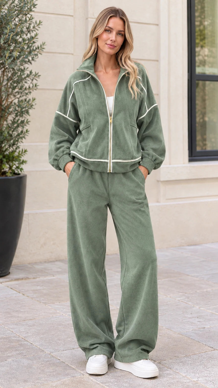 Front view of woman wearing sage green ribbed corduroy tracksuit set