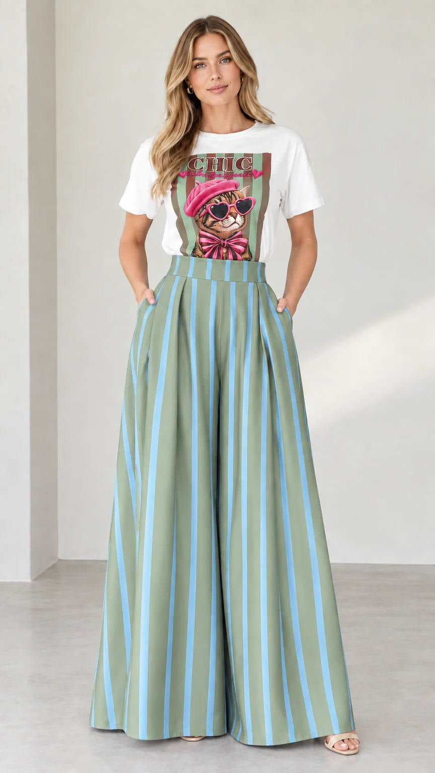 Full-length shot of white graphic tee and sage green striped wide-leg pants set