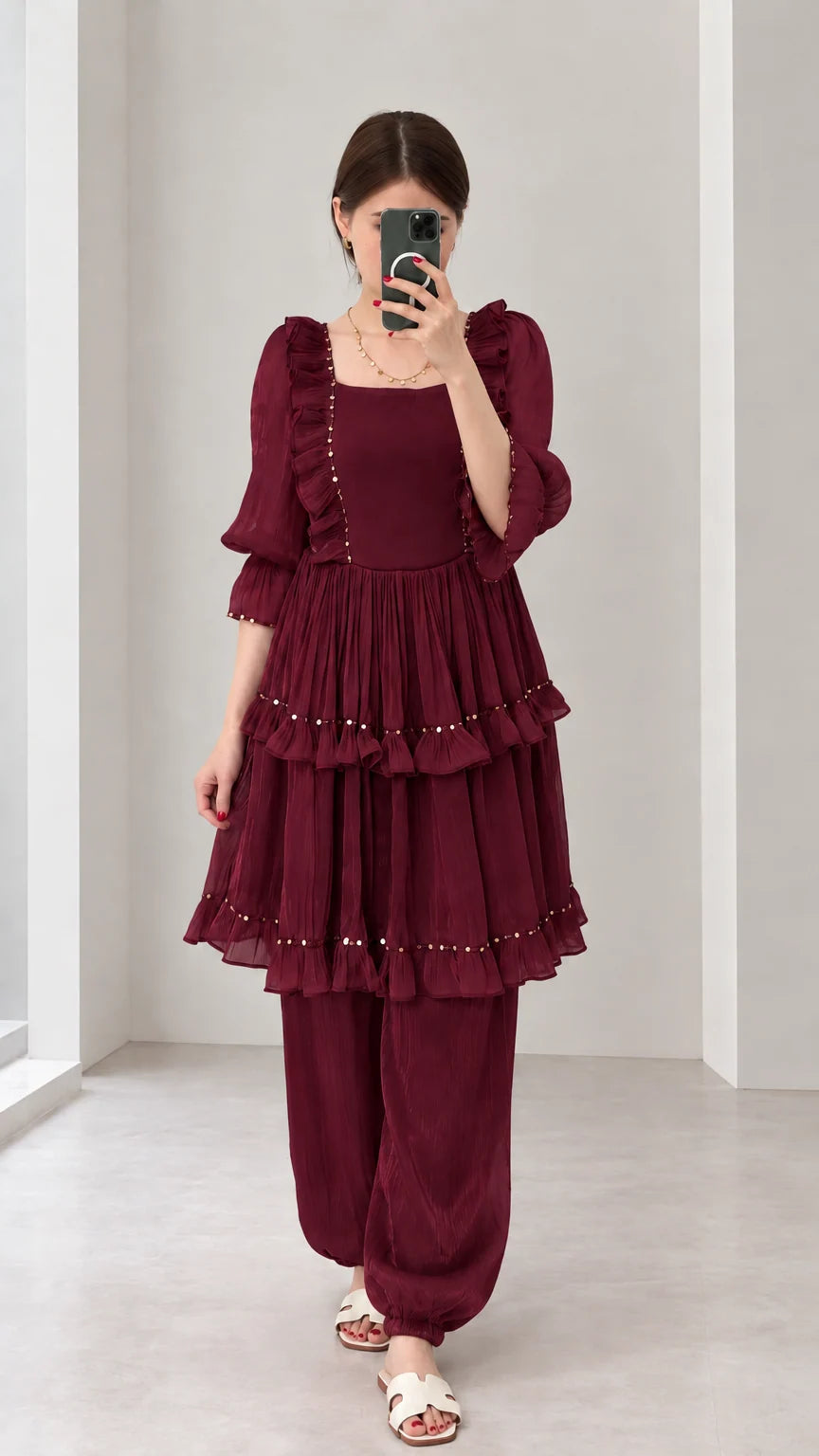 Front view of woman wearing Burgundy tiered ruffle tunic and matching pant outfit