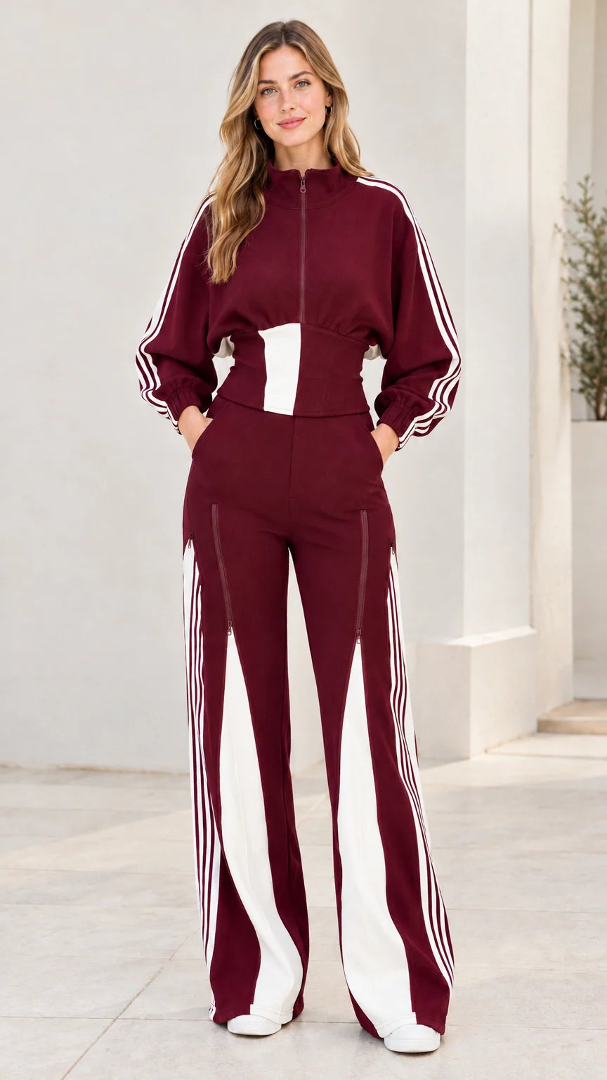 Front view of model wearing burgundy wine red two-piece striped tracksuit set