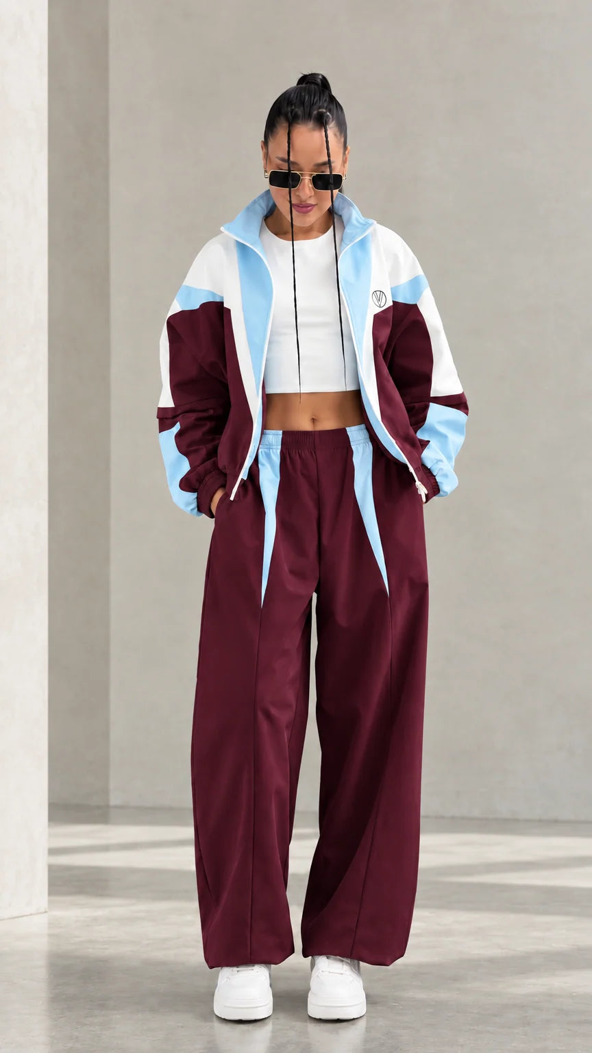 Model wearing Burgundy colorblock tracksuit set with light blue and white accents