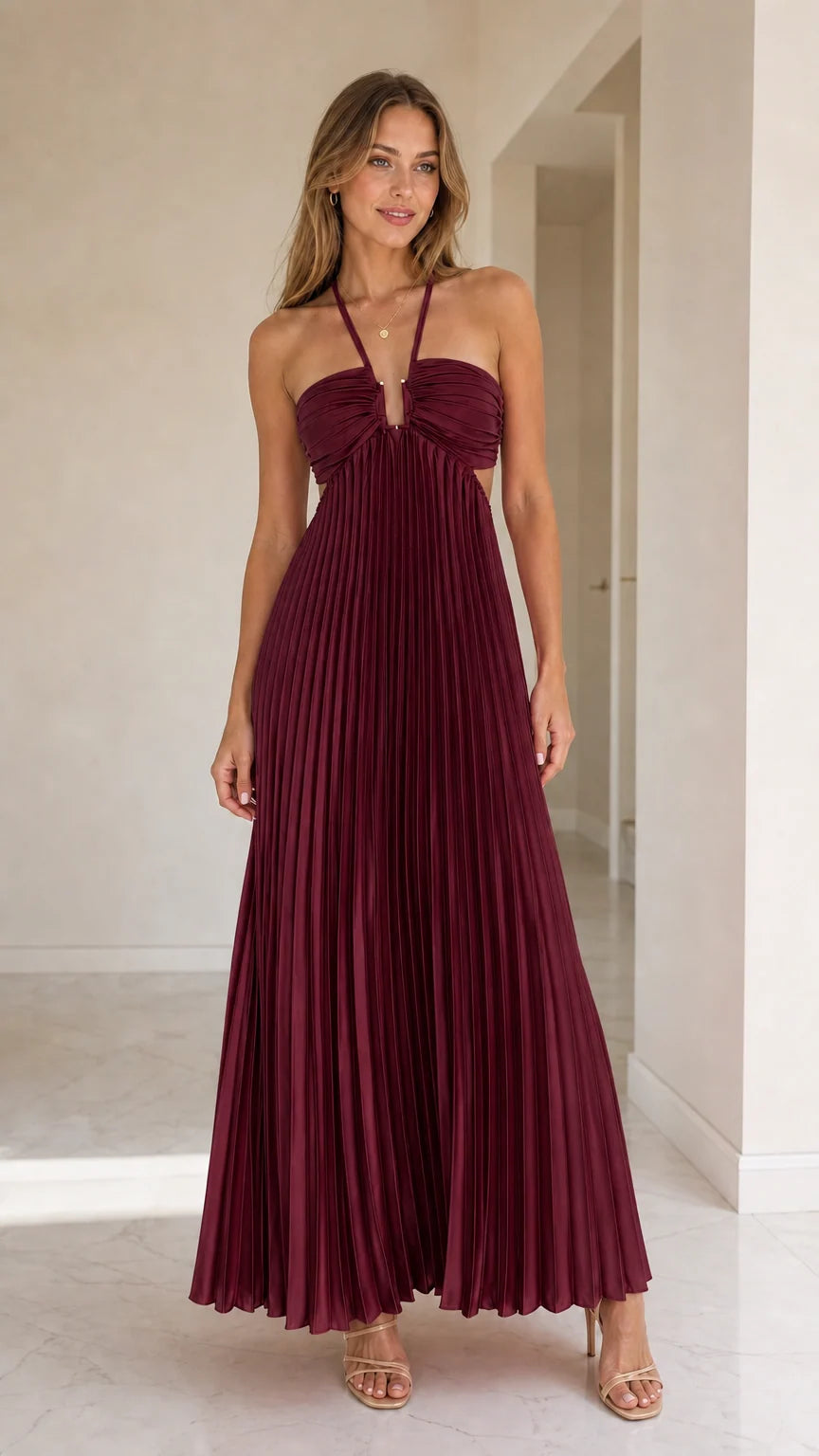 Model wearing burgundy halter pleated maxi dress