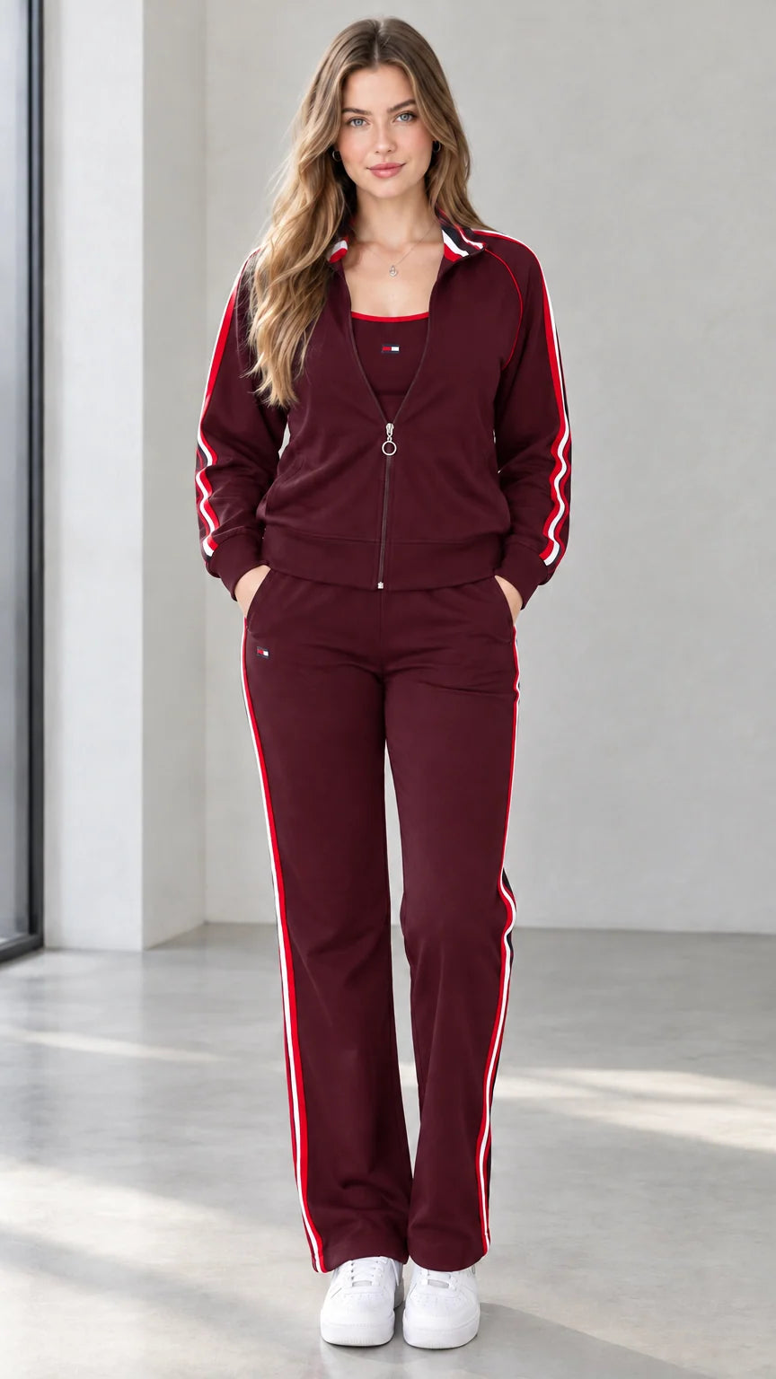 Front view of woman wearing burgundy wine contrast stripe track jacket and pants set