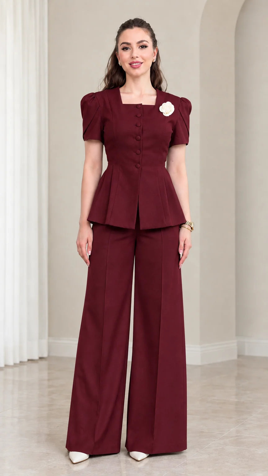 Model wearing Burgundy tailored peplum suit set with wide leg trousers
