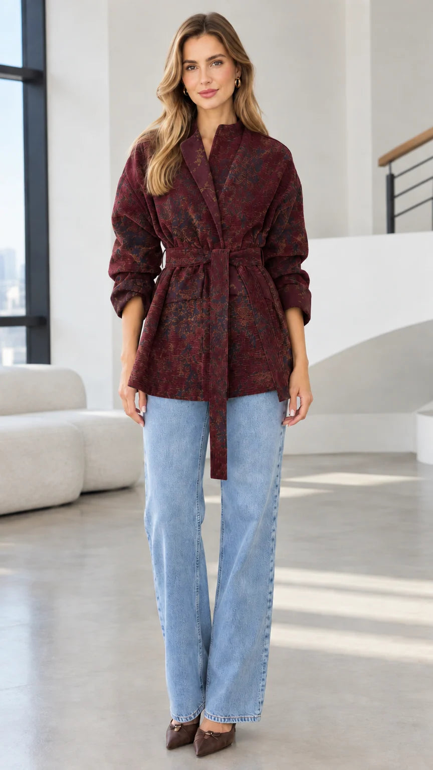 Model wearing deep burgundy wine floral jacquard belted wrap jacket