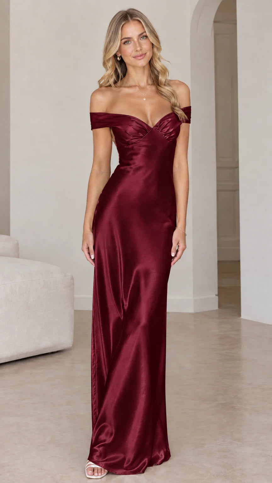 Front view of woman wearing burgundy off-the-shoulder satin maxi gown