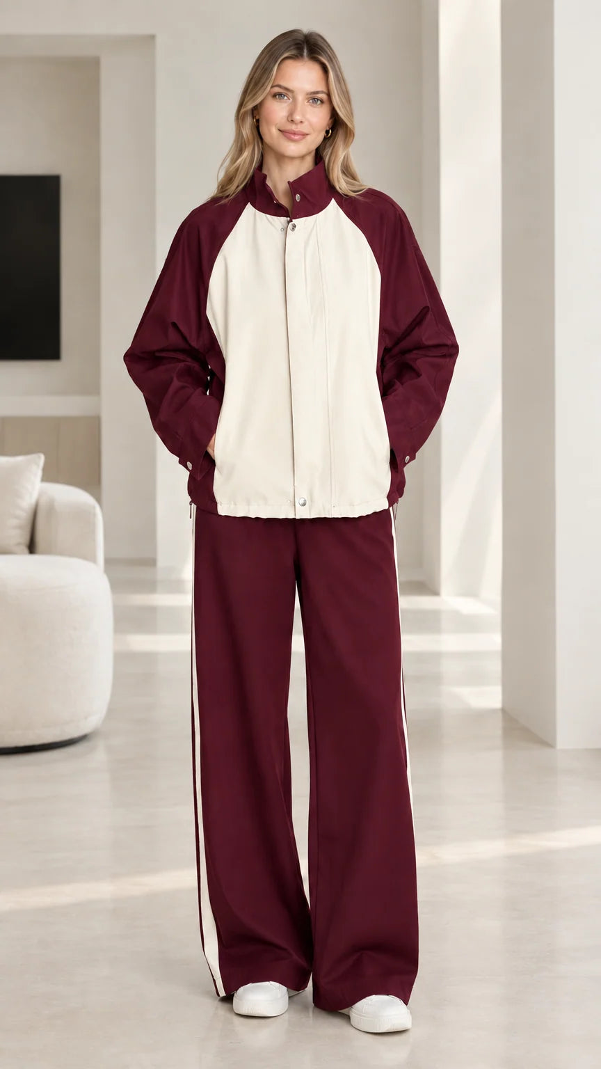 Burgundy red and cream colorblock two-piece tracksuit set on model