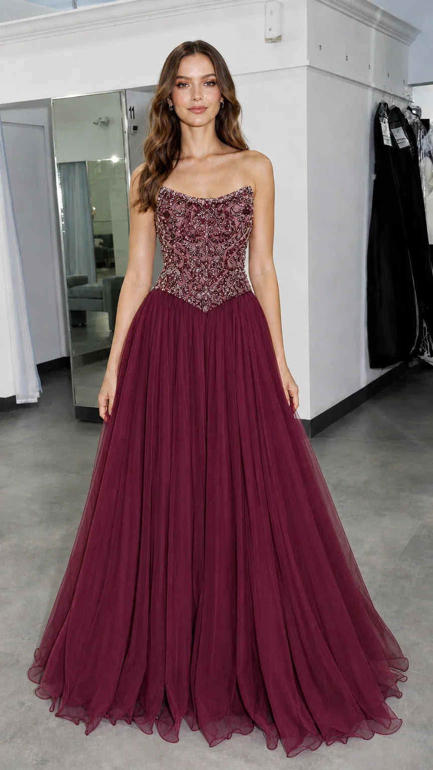 Front view of model wearing burgundy formal gown