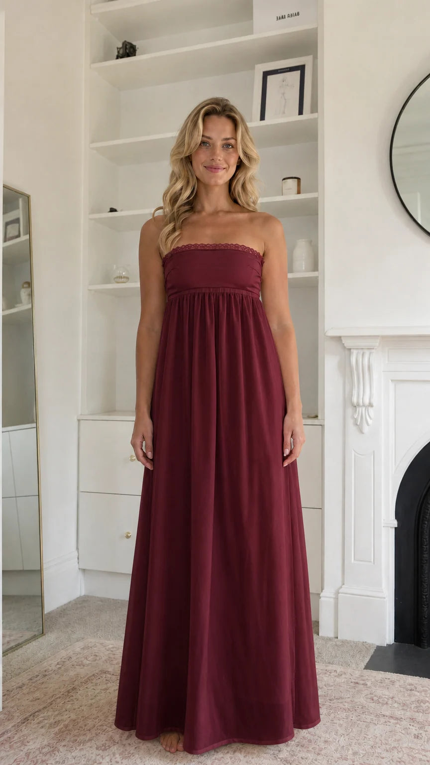 Woman wearing burgundy strapless maxi dress