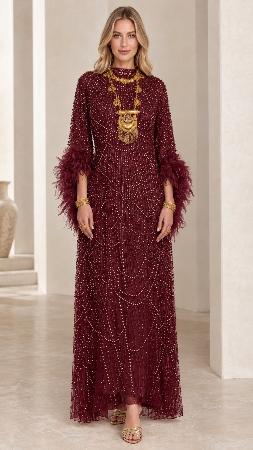 Front view of burgundy wine beaded evening gown with feather cuffs