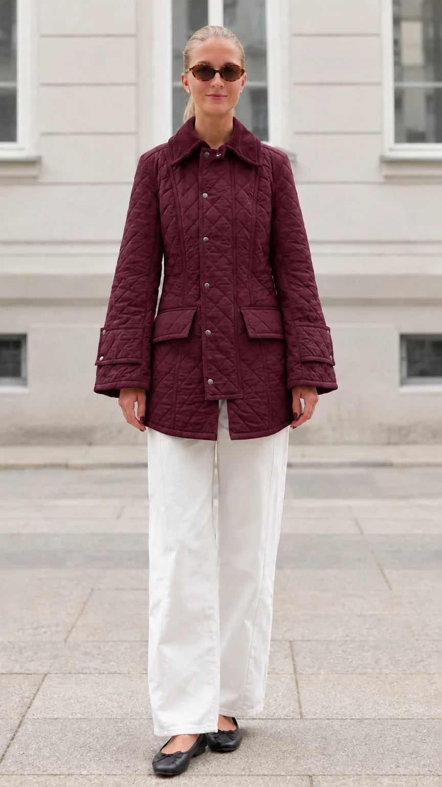 Front full-length view of woman wearing burgundy diamond quilted barn jacket