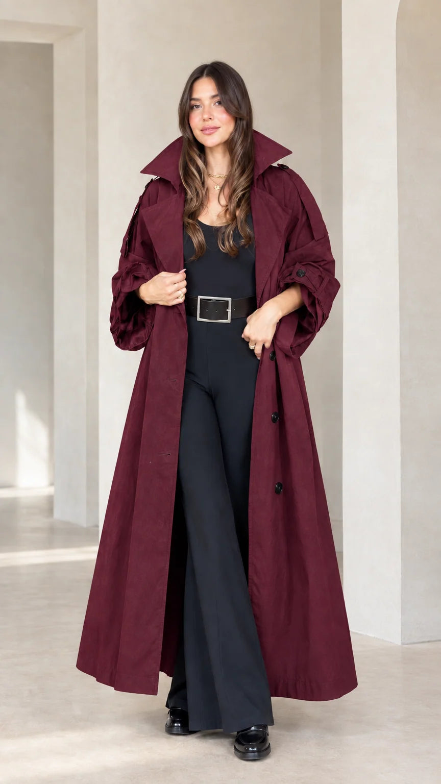 Front view of woman wearing burgundy wine red maxi trench coat
