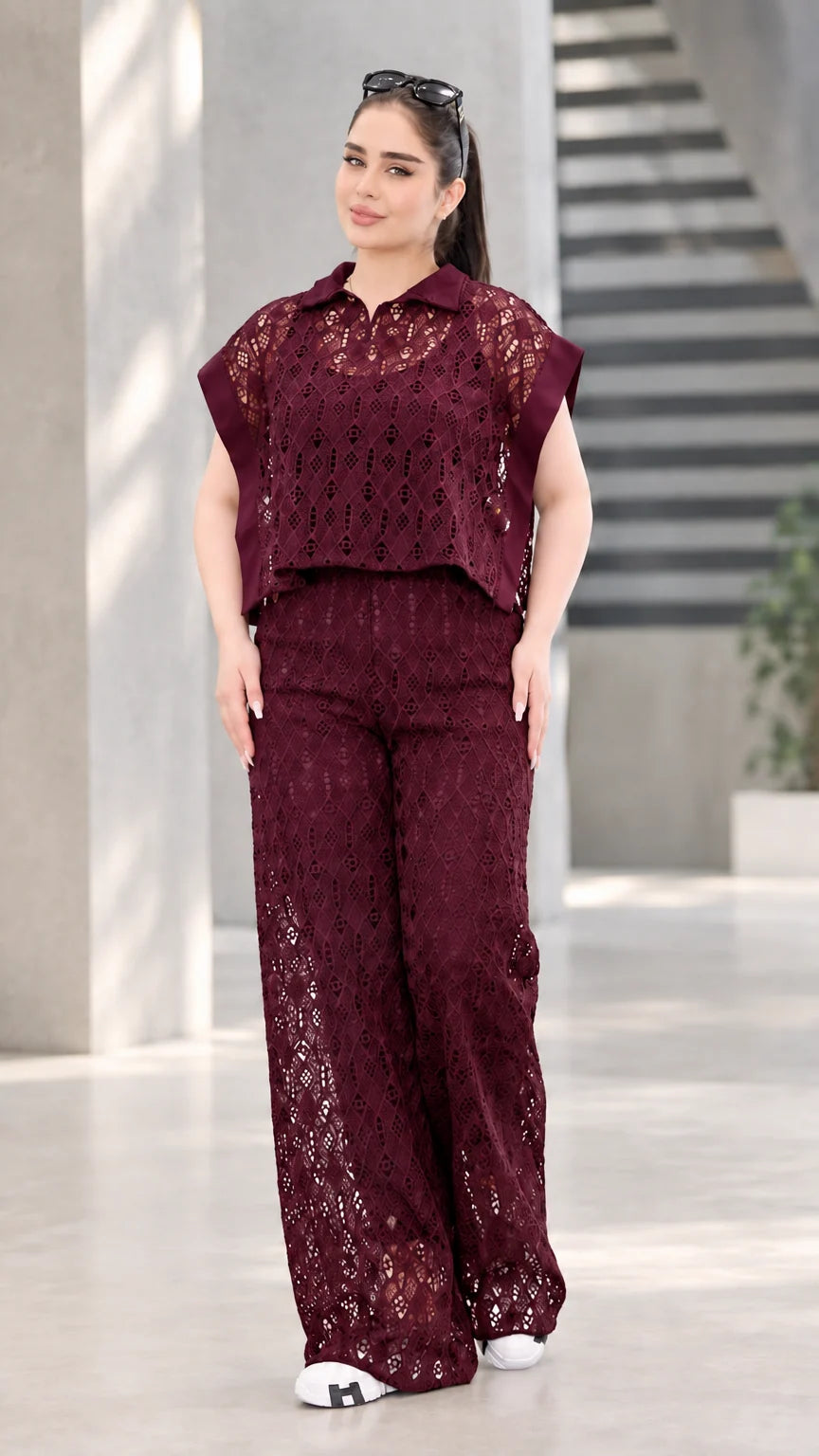 Front view of woman wearing burgundy wine lace two-piece top and wide-leg pants set