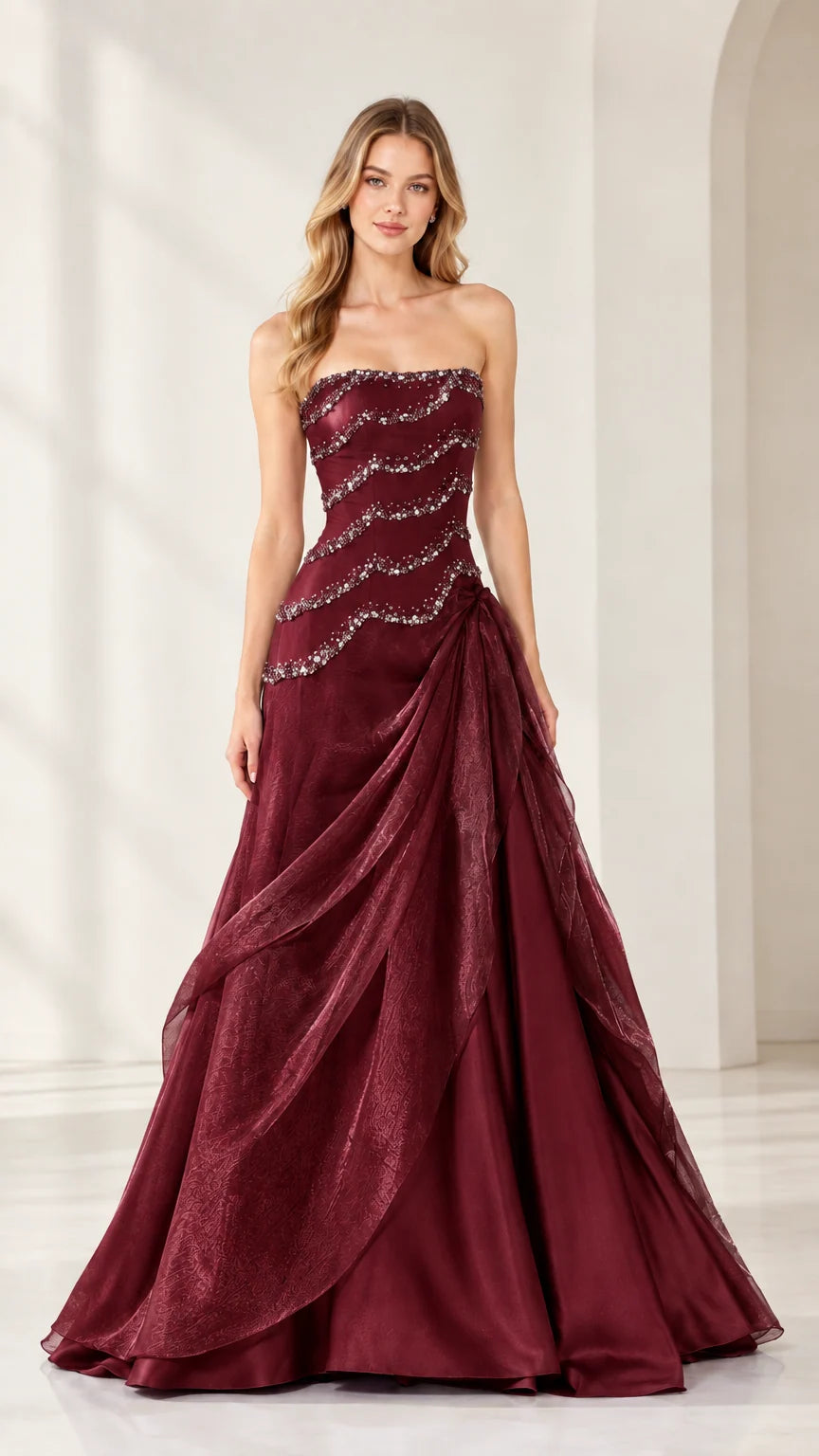 Full-length view of strapless beaded cascading formal ball gown in Burgundy