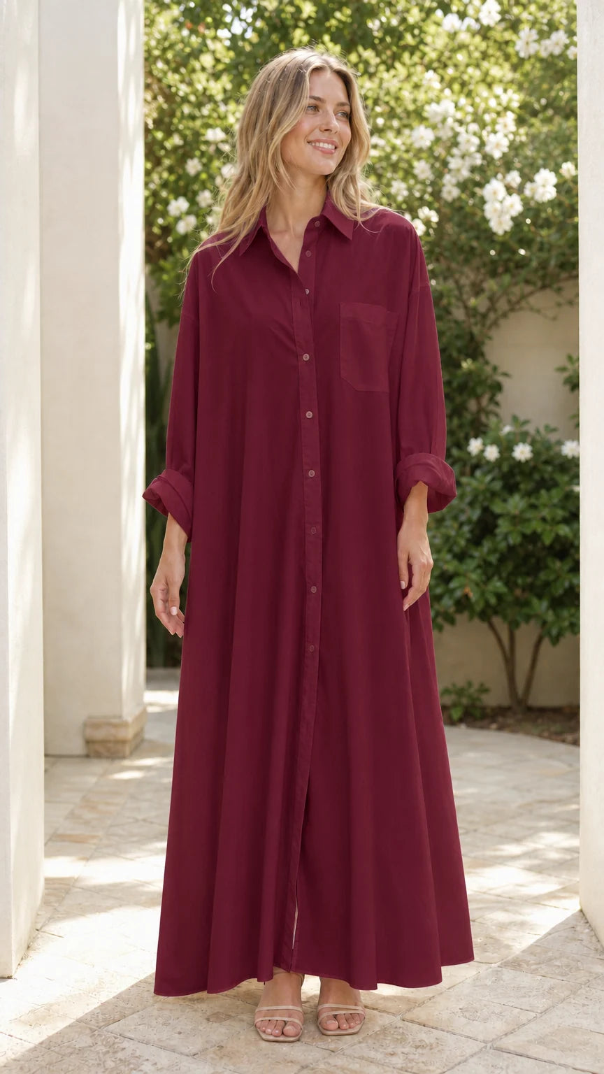 Woman wearing rich burgundy button-down floor-length shirt dress