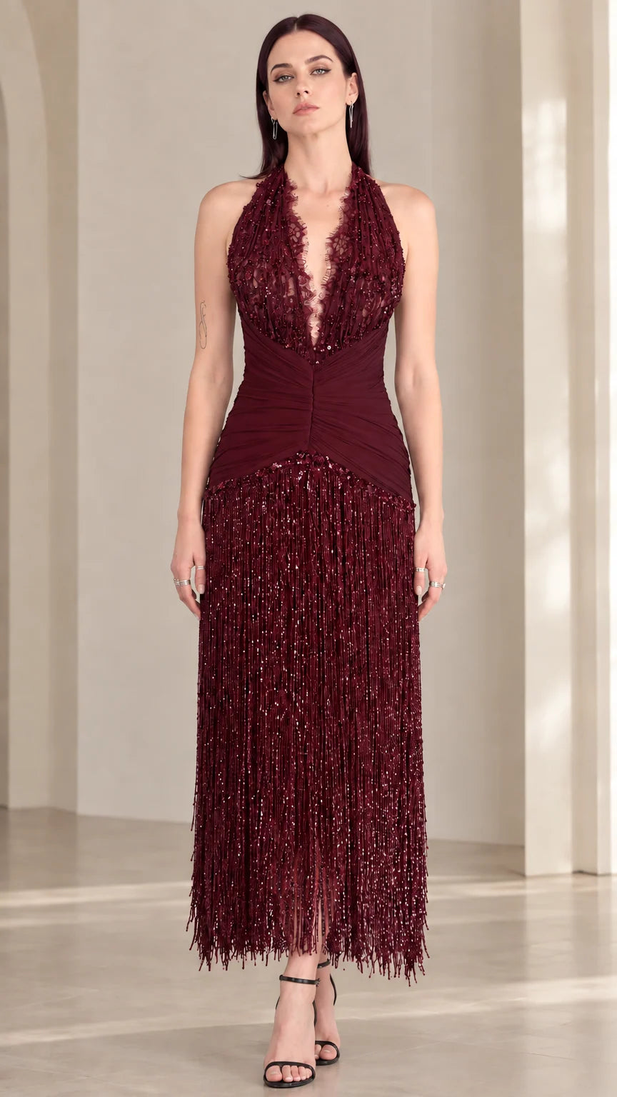 Front view of burgundy wine red halter sequin fringe evening dress