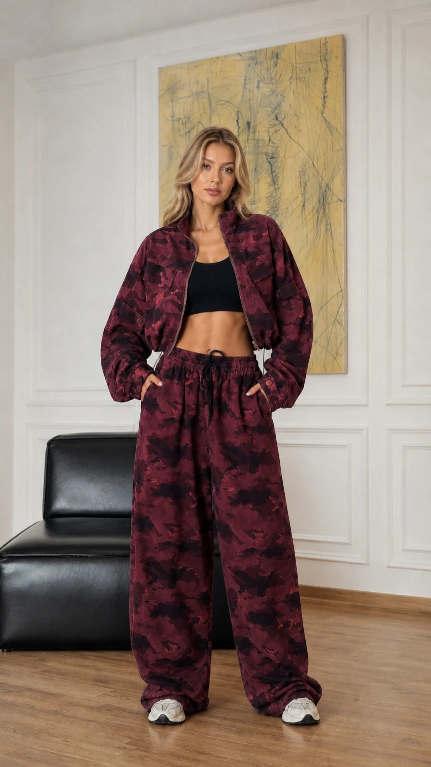 Model wearing burgundy camouflage cropped jacket and wide-leg pants set