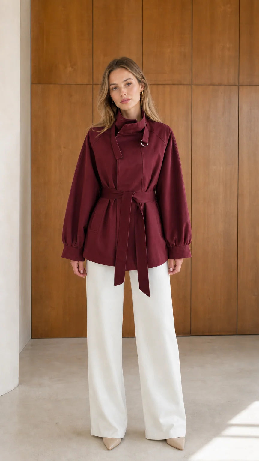 Model wearing burgundy wine red high neck belted short trench jacket