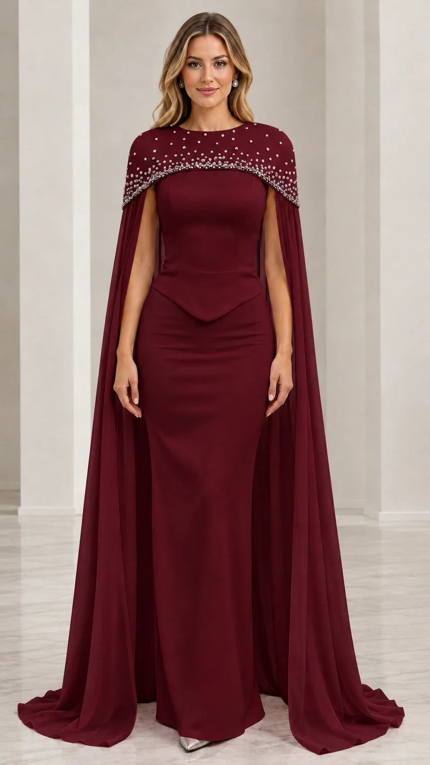 Model wearing burgundy wine capelet evening gown with beaded neckline