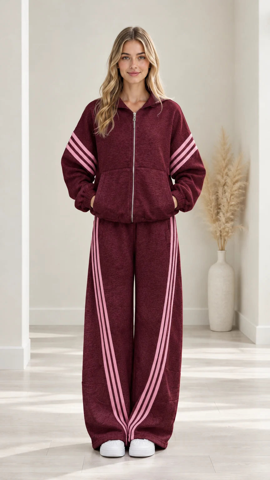 Woman modeling Burgundy two-piece fleece tracksuit set with pink stripe trim