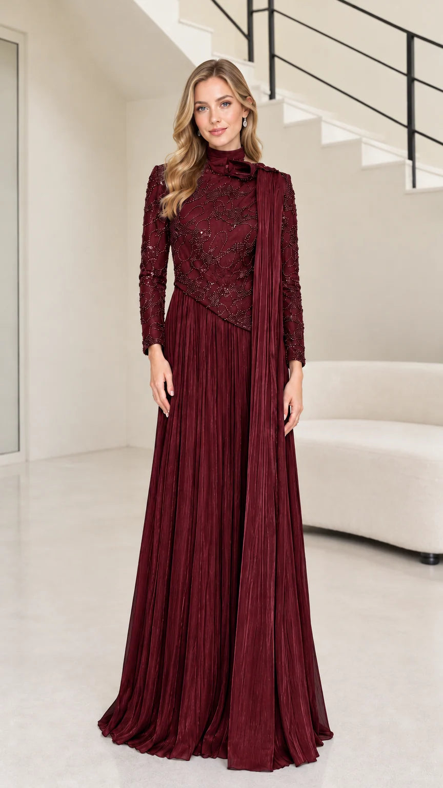 Front full-length view of burgundy red long sleeve beaded mock neck pleated maxi gown